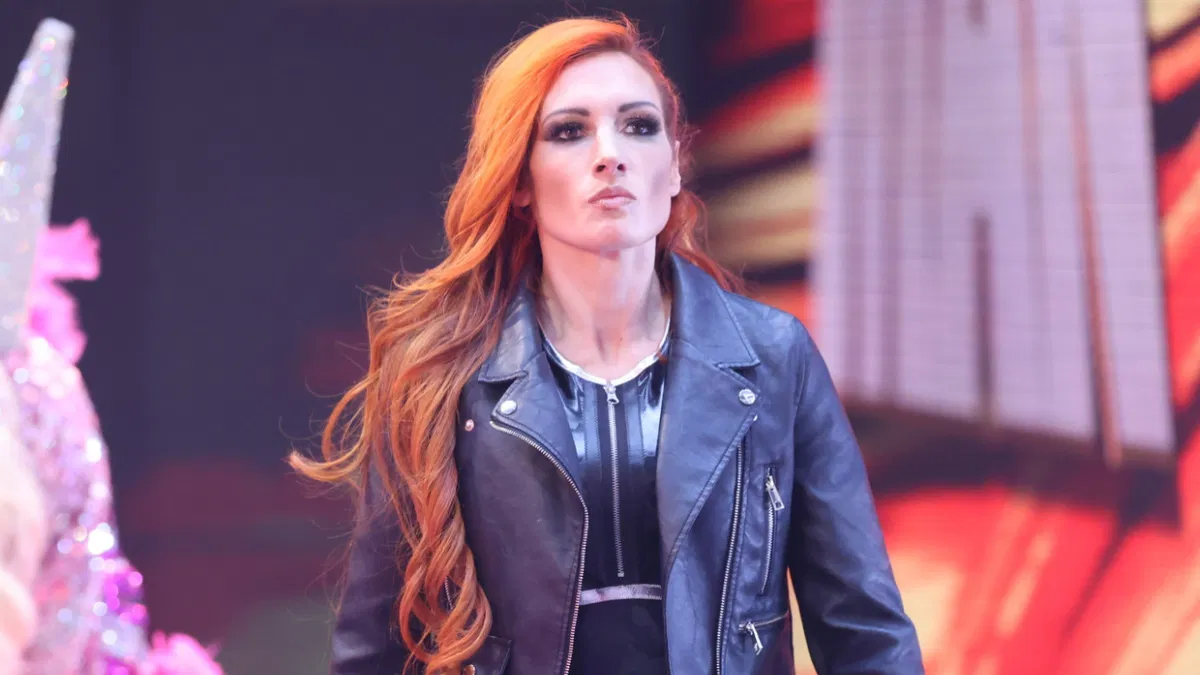 A photo of Becky Lynch in a wrestling ring, looking toward the camera.
