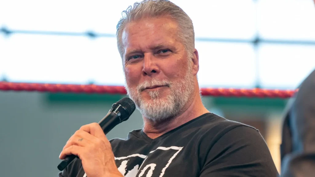 Kevin Nash during a recent interview with AJ Styles in the background, symbolizing the connection between the two WWE legends.