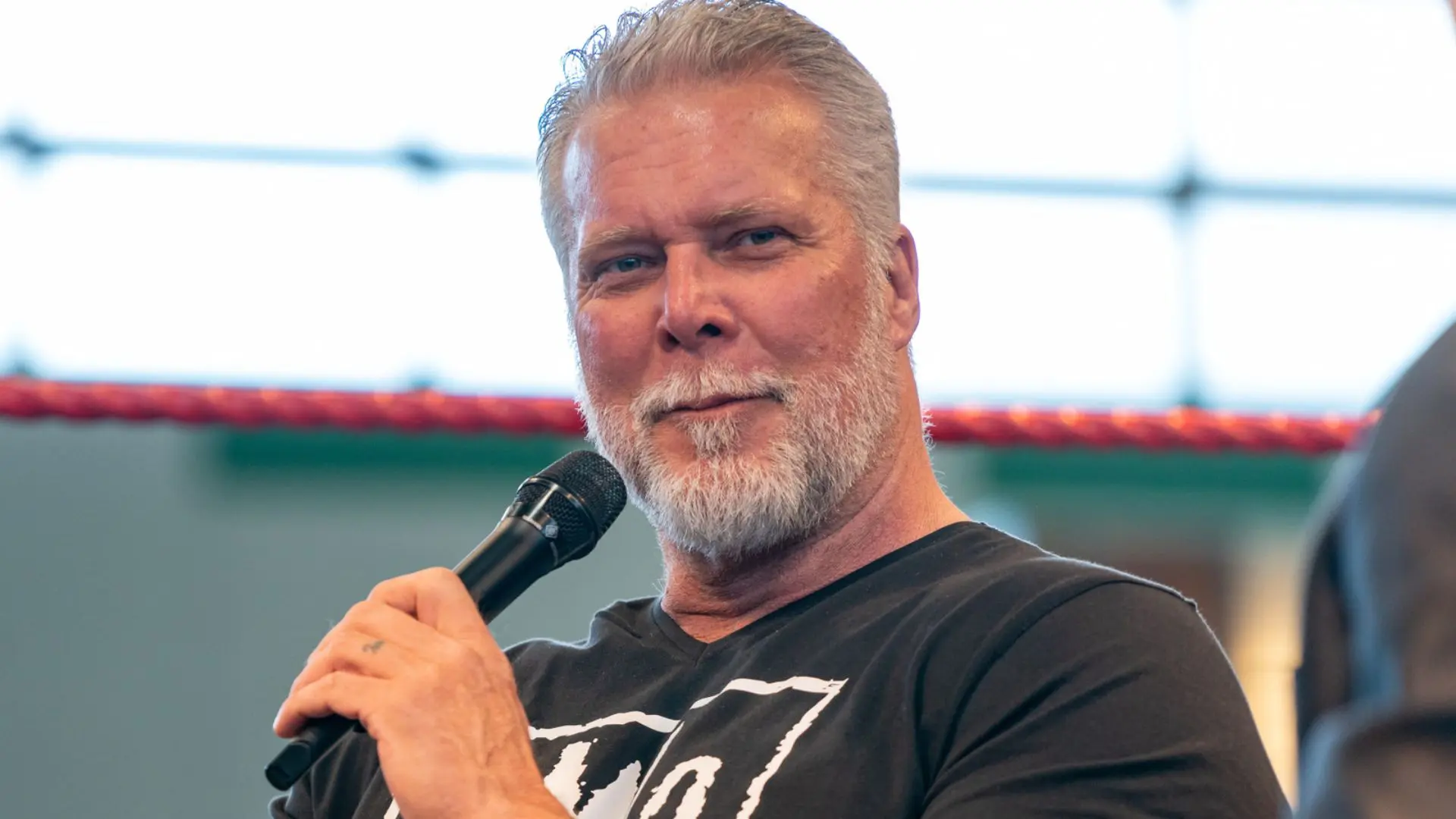 Kevin Nash during a recent interview with AJ Styles in the background, symbolizing the connection between the two WWE legends.