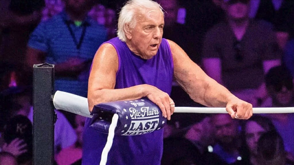 Professional wrestling legend Ric Flair, bloodied and exhausted, leans on the ring ropes during his final advertised match at the Nashville Municipal Auditorium on July 31, 2022.