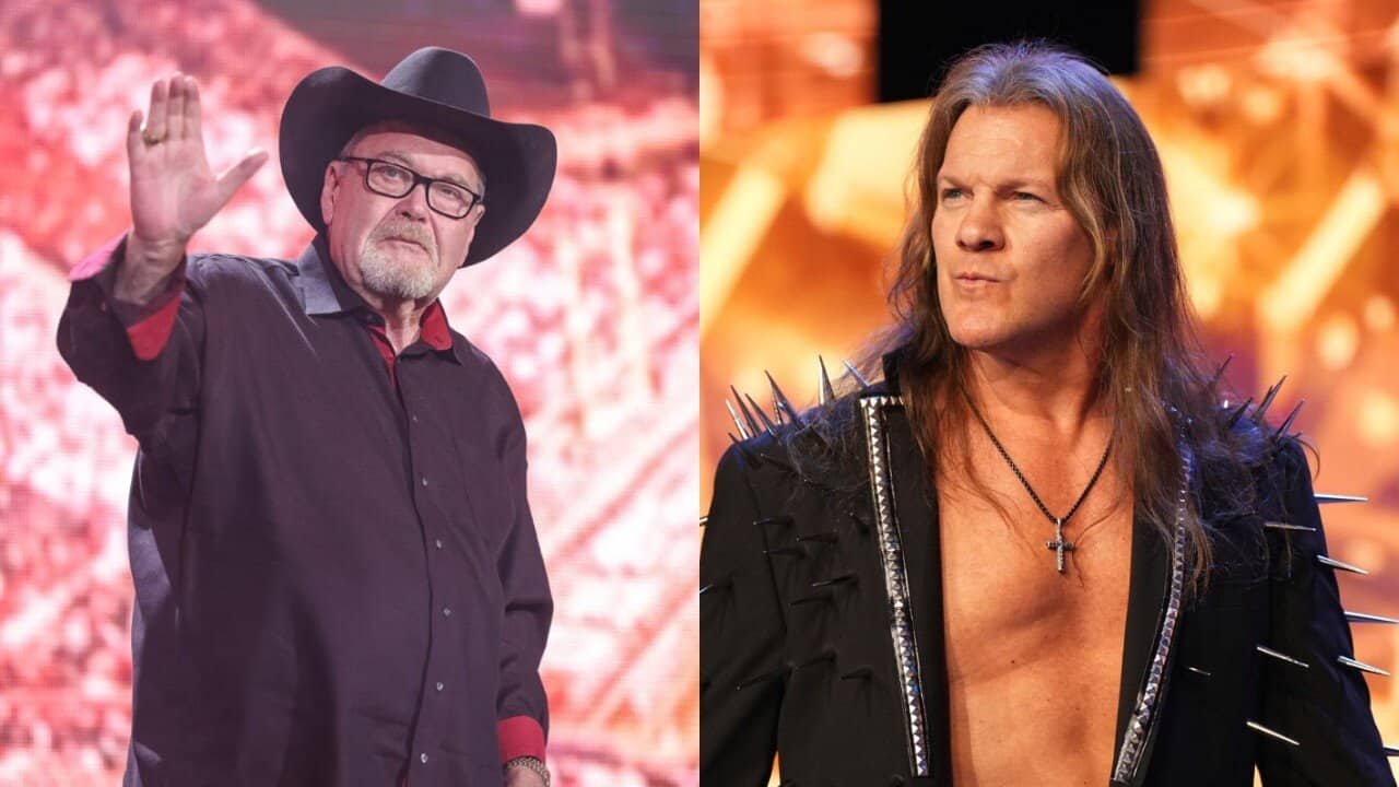 Professional wrestler Chris Jericho, with long hair and a purple sparkly jacket, smiles in a brightly lit arena.