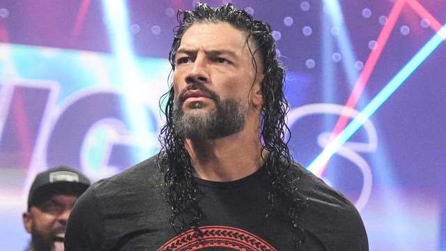 Roman reigns looks intense under bright arena lights during a wwe raw appearance - tjr wrestling