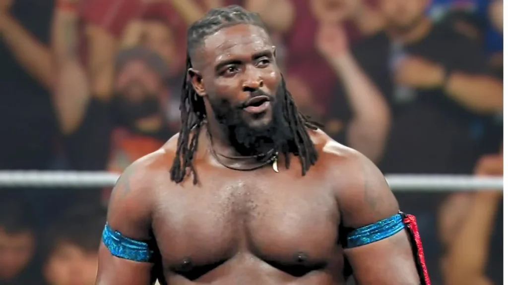 Oba femi issues open challenge on raw - tjr wrestling Oba femi stands in a wwe ring, looking intense as the crowd reacts in the background.