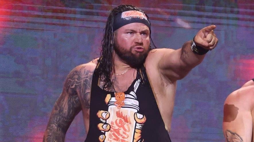 Bear bronson celebrates after winning the wrestling open championship at the star spangaled spectacular event. - tjr wrestling