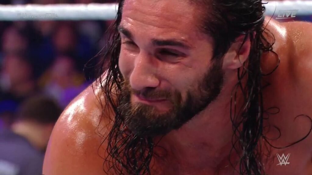 Seth rollins down on his knees alone in wwe raw ring after vision attack