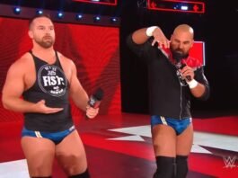 FTR Shocks Fans With Big Wrestling Break After Many Years Cash Wheeler and Dax Harwood of tag team FTR standing on the WWE Raw entrance ramp, both holding microphones, with Cash wearing a black "No Frills Just Fists" tank top and blue trunks, and Dax in a black zip-up jacket and matching blue trunks, gesturing while speaking, with the red WWE Raw LED set visible in the background and a WWE Live watermark in the corner.