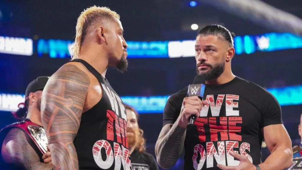 Roman reigns faces off with solo sikoa during a tense wwe smackdown segment as the bloodline storyline continues to unfold.