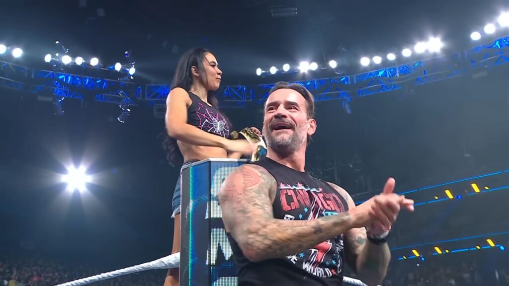 Aj lee and cm punk react to the crowd during aj lee's return appearance on wwe smackdown. - tjr wrestling