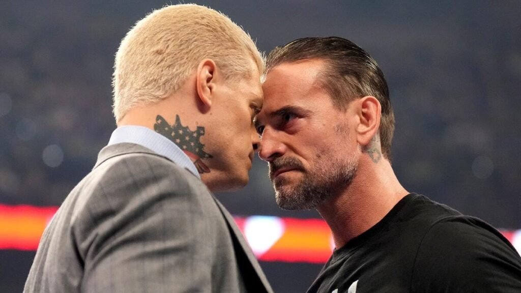 Cm punk, cody rhodes, and danhausen celebrate together after a wwe live event, sharing a lighthearted moment before summerslam. - tjr wrestling