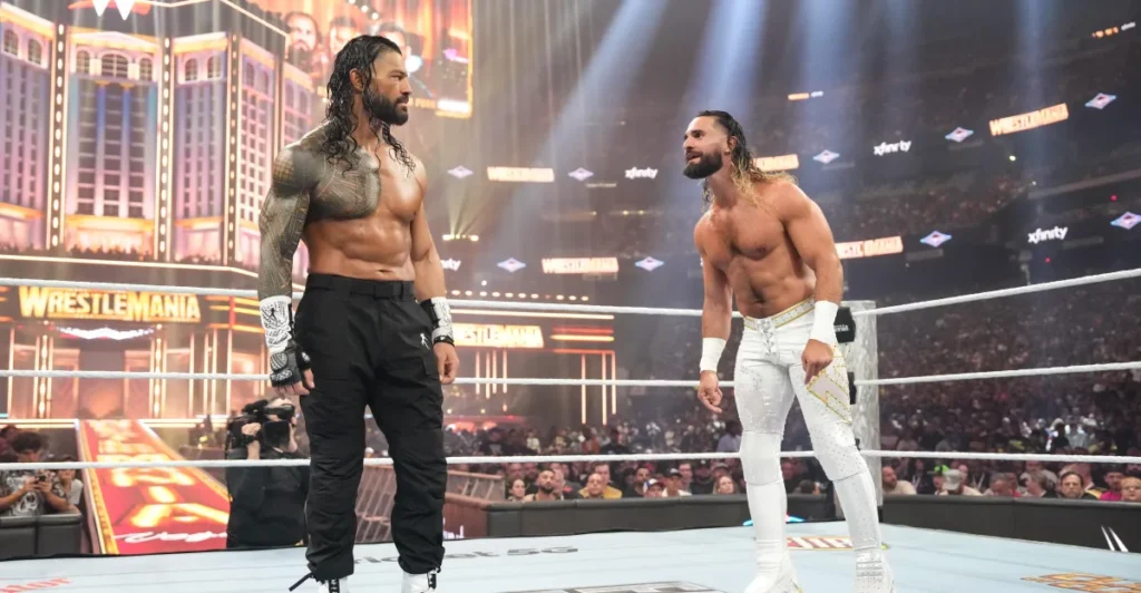 Roman reigns and seth rollins confront each other in the ring during a heated wwe segment ahead of their summerslam match. - tjr wrestling