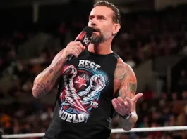 CM Punk stands in the WWE ring holding the Undisputed WWE Championship after opening up about the personal reasons behind his recent absence.