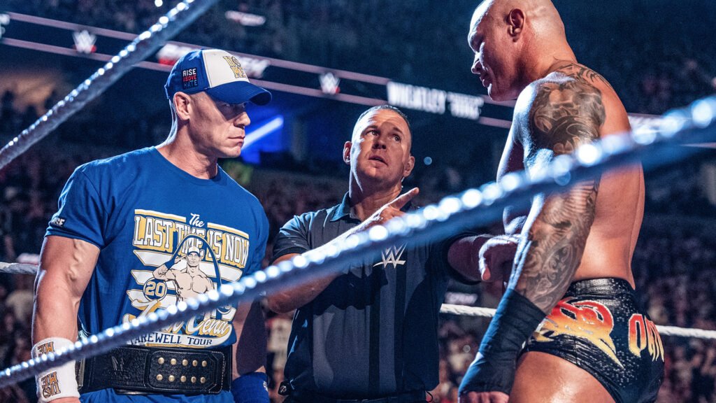 John cena and randy orton face off inside a wwe ring during a championship match. - tjr wrestling