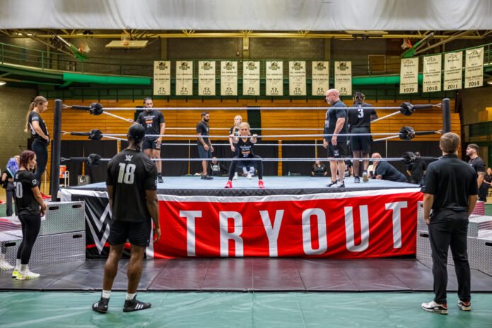 WWE wrestlers participating in a tryout session inside a wrestling ring