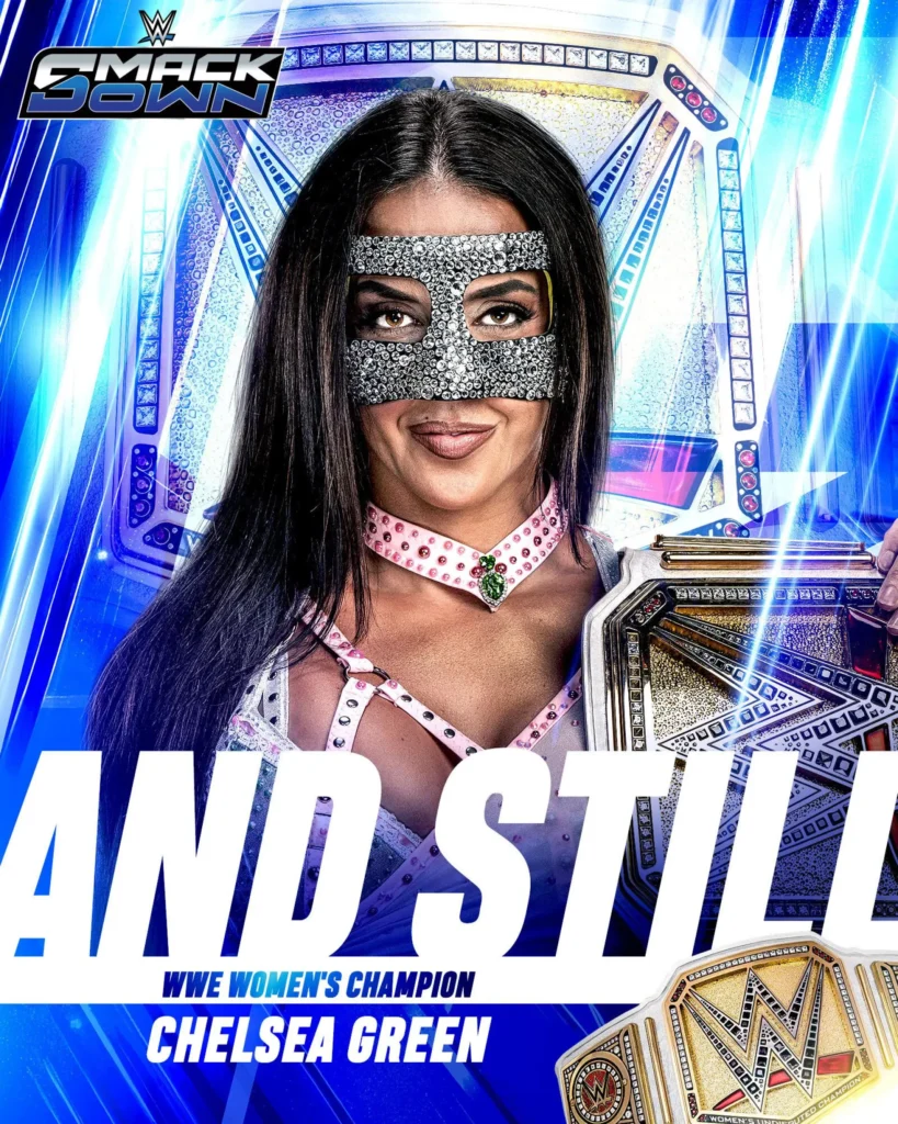 Wwe superstar chelsea green wearing a sparkly mask and holding a championship belt with text reading "and still".