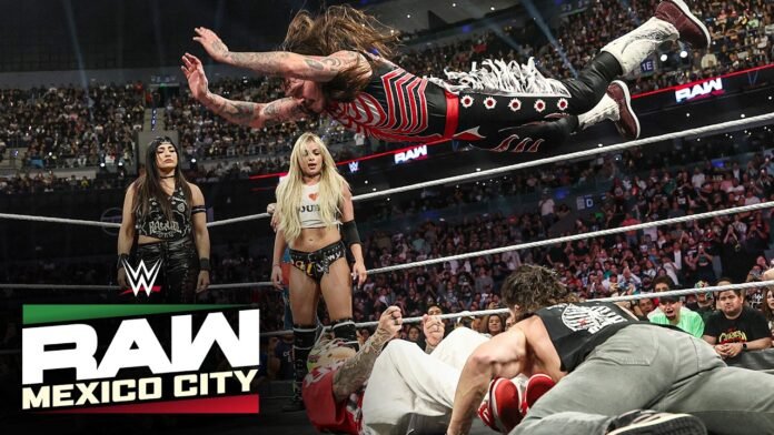 Dominik Mysterio flying through the air inside the ring during a match at WWE Raw in Mexico City.
