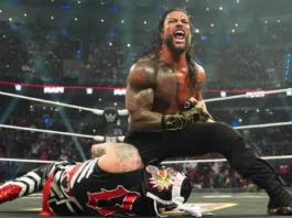 Roman Reigns Missing From Massive Bloodline Match WWE Superstar Roman Reigns roaring in victory over a fallen Penta inside a packed wrestling arena ring.